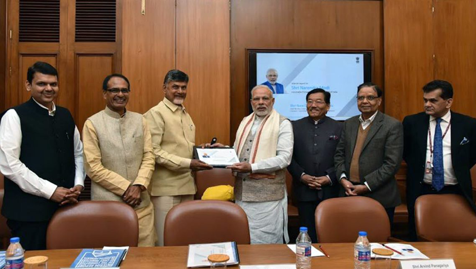 Government officials, including Prime Minister Narendra Modi, at a formal meeting